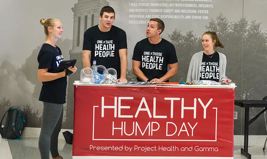 Project Health and Gamma students run a Healthy Hump Day table in the UA Student Center